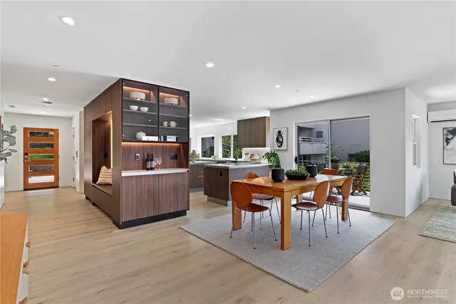 a view of a dining room with furniture window and wooden floor