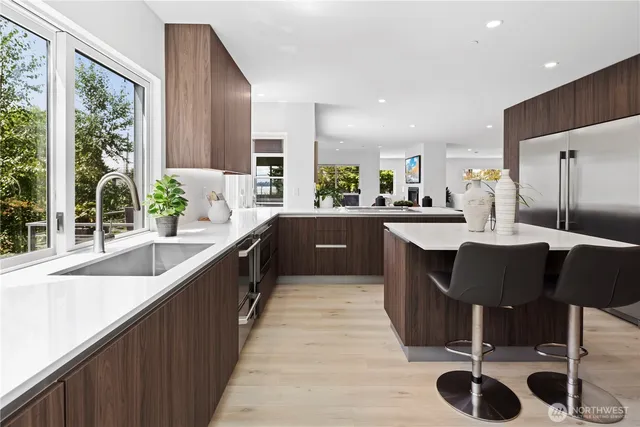 a large kitchen with a table and chairs