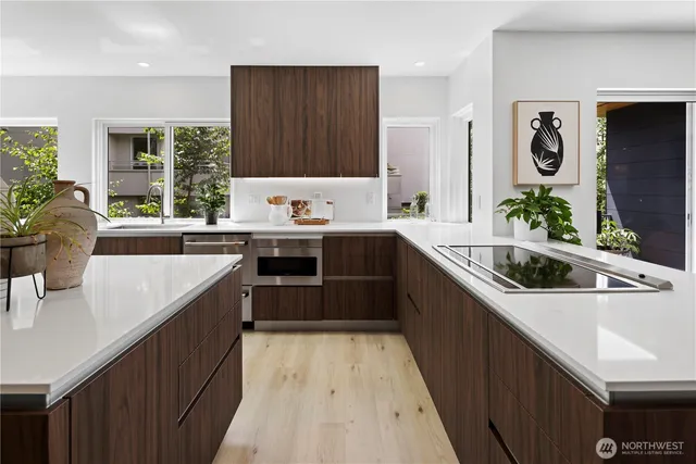 a kitchen with a sink stove and cabinets