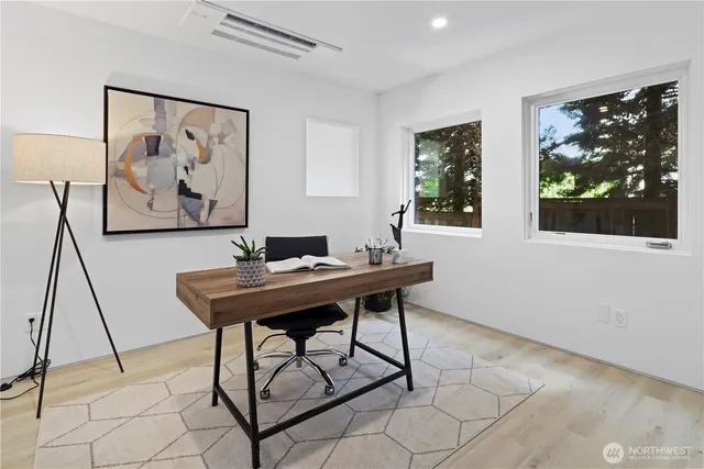 a view of a workspace with furniture