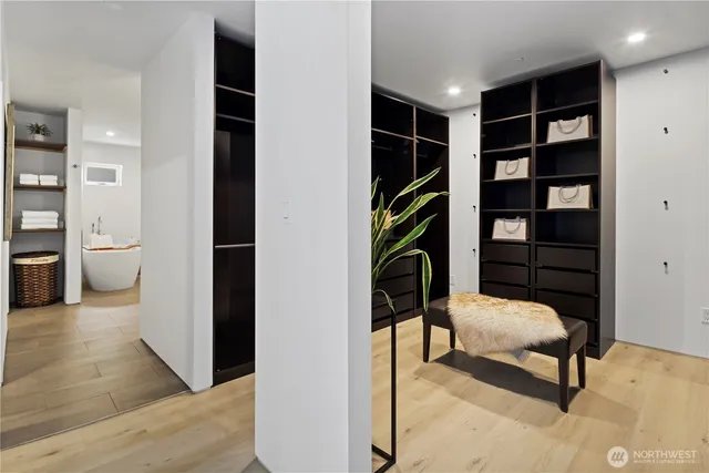 a living room with furniture and a book shelf