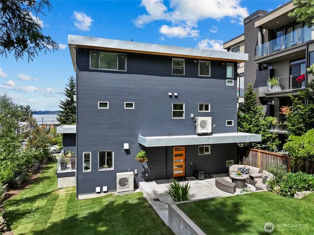 a aerial view of a house with a yard patio and fire pit