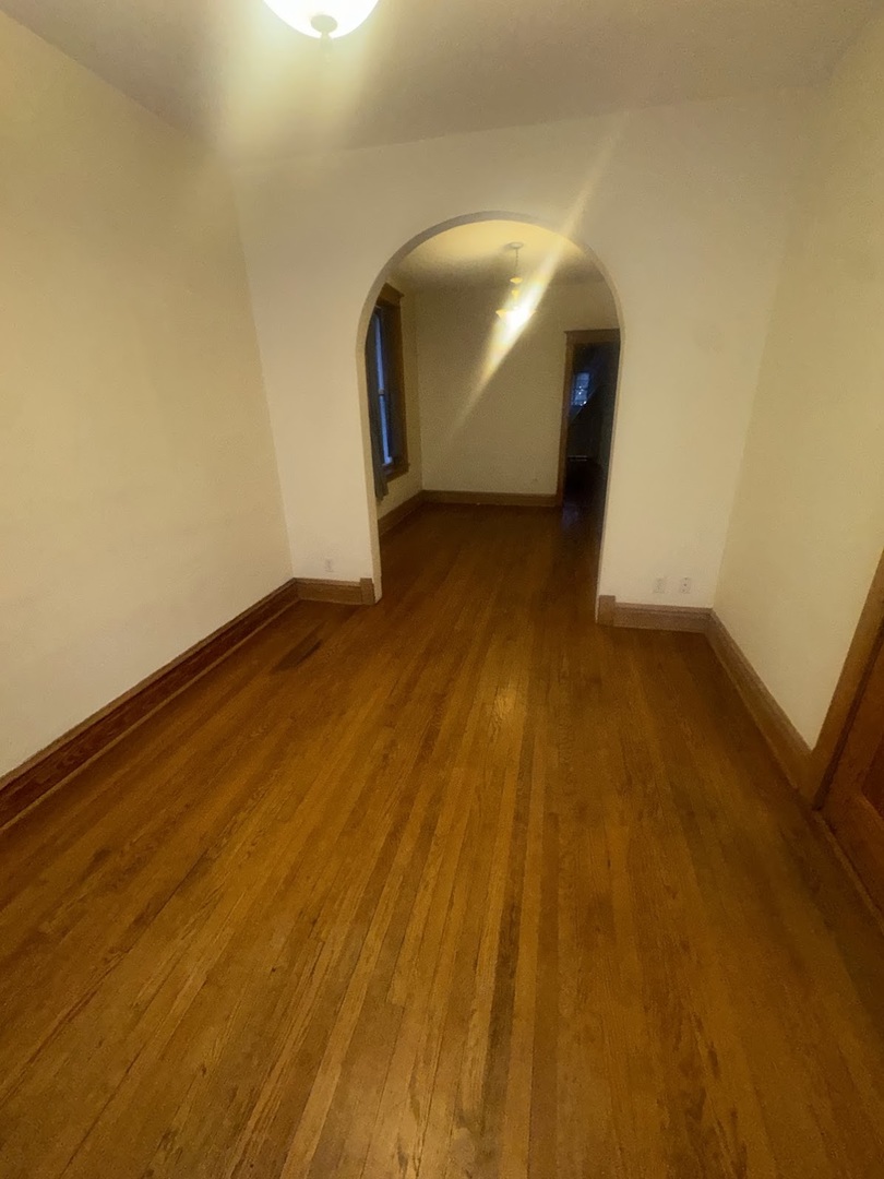 3030 West Belden Avenue Chicago, IL 60647 - Photo 2 of 12 a view of empty room with wooden floor