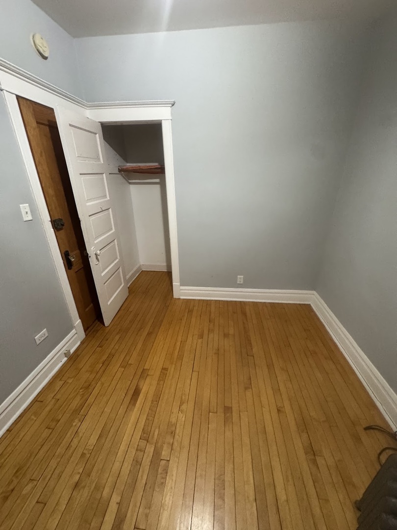 3030 West Belden Avenue Chicago, IL 60647 - Photo 7 of 12 a view of wooden floor in a room