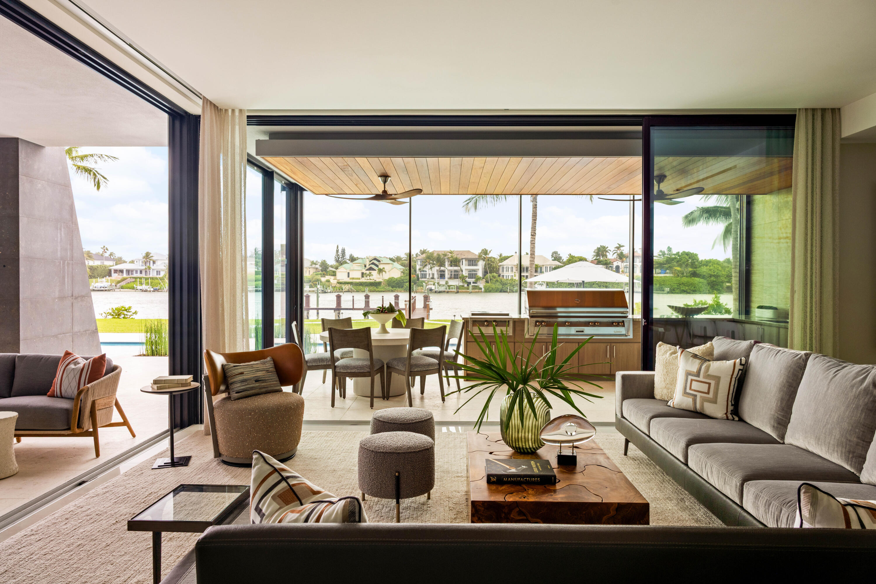 488 South Beach Road Jupiter Island, FL 33455 - Photo 11 of 54 a view of a living room with furniture and floor to ceiling windows