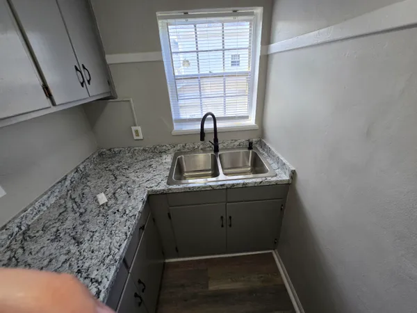 a bathroom with a sink and a window