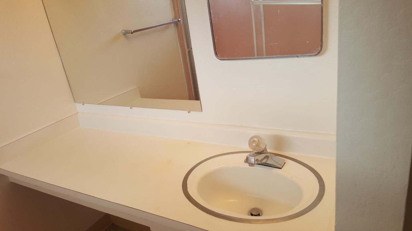 South Norfolk Street San Mateo, CA 94401 - Photo 7 of 8 a bathroom with a sink and a mirror