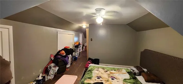 a bedroom with a bed and a mirror