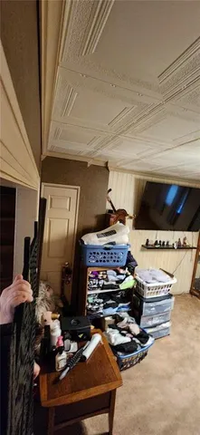 a room with furniture and flat screen tv