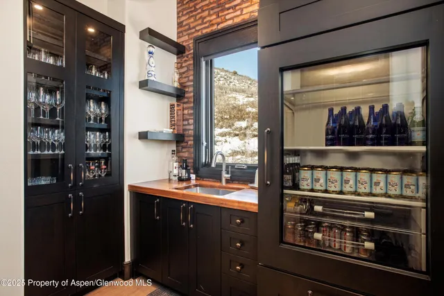 a kitchen with stainless steel appliances a stove and a refrigerator