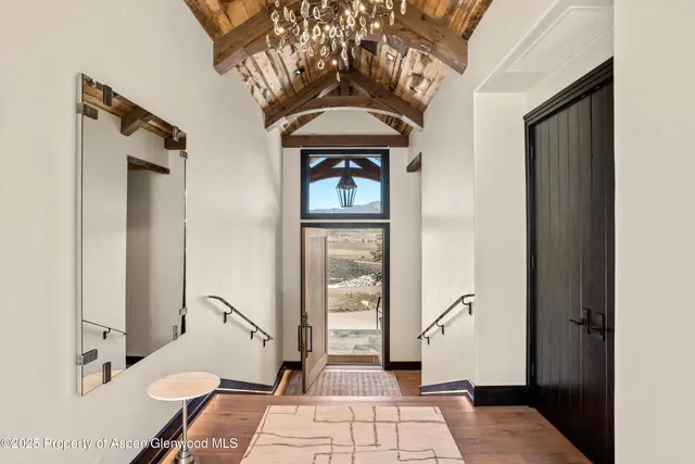 a living room with a furniture and a rug