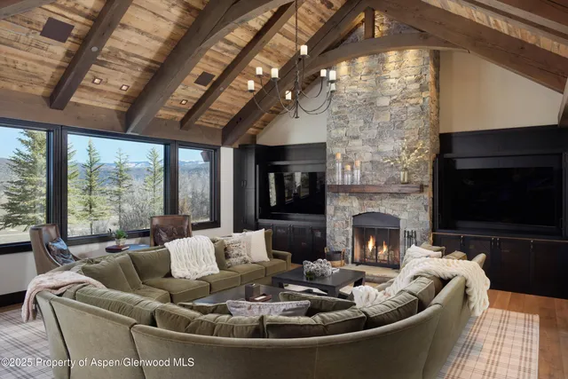 a living room with furniture fireplace and a flat screen tv