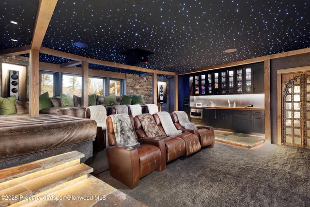 a bedroom with furniture and large window