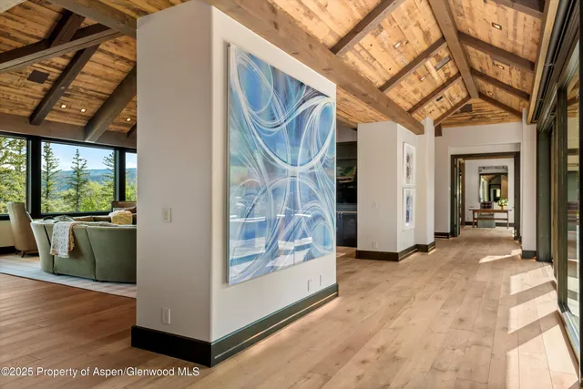 a view of a room with wooden floor and door