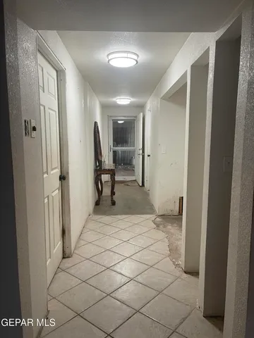 a spacious bathroom with a sink and mirror