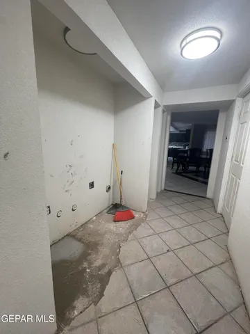 a living room with furniture a air conditioner and a table