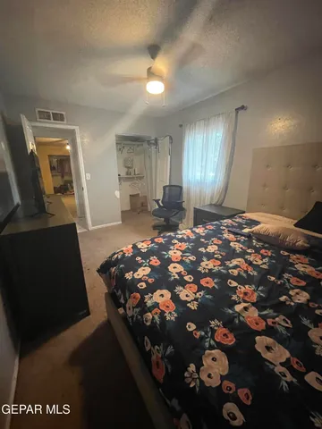 a view of a big room with windows and lounge chair