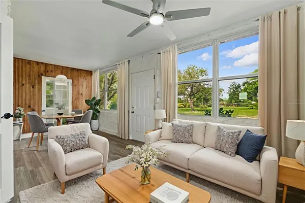 a living room with furniture and a large window