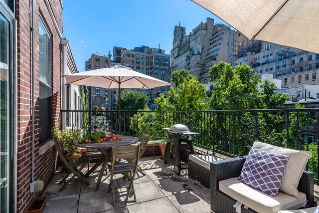a view of a patio with furniture and a table