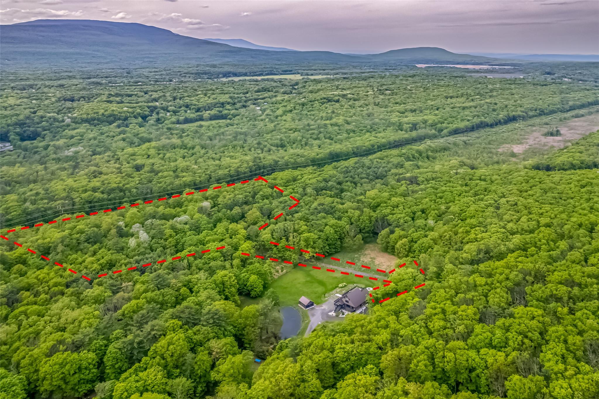 Mossy Hill Road Road Catskill, NY 12414 - Photo 9 of 11 Aerial overview of property's location with a heavily wooded area, property boundaries highlighted, and a mountainous background