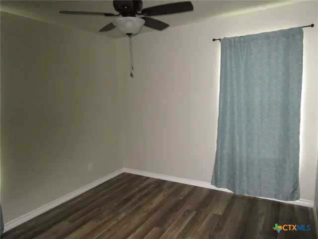 a view of small space with wooden floor