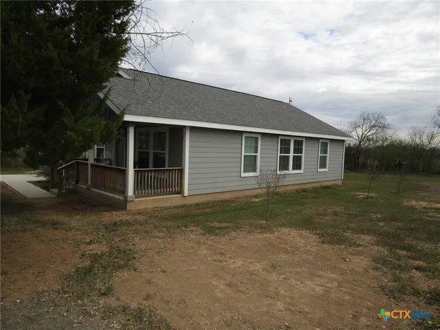 a backyard of a house with lots of green space