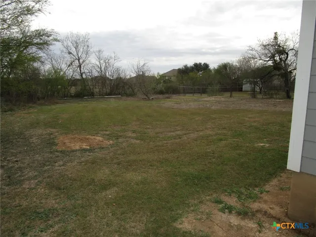 a view of a lake with a yard