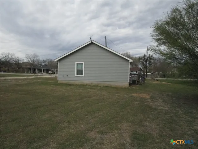 a house view with a backyard space