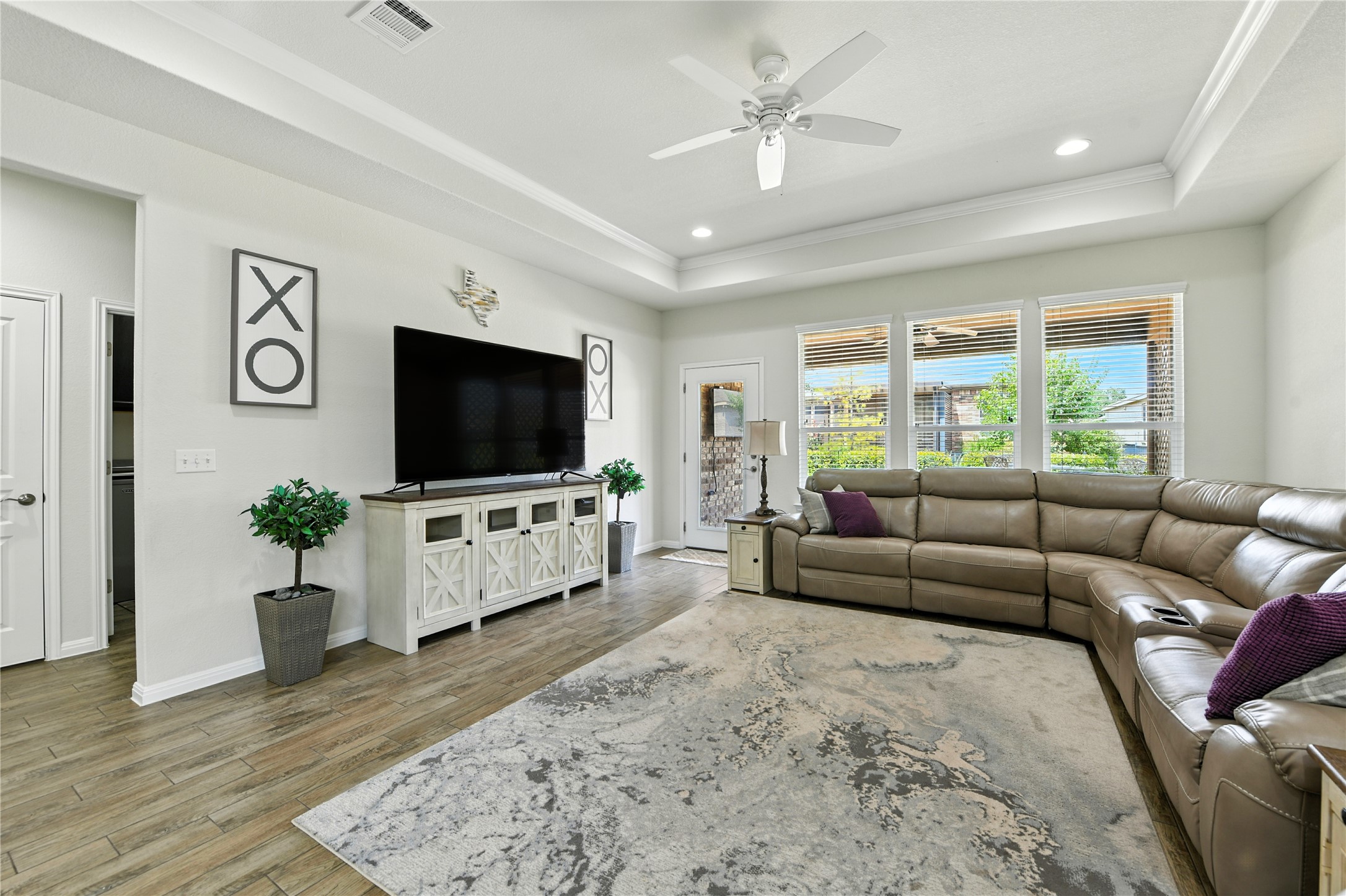 107 Calhoun Lane Georgetown, TX 78633 - Photo 10 of 36 Living room features plenty of windows bringing in natural light