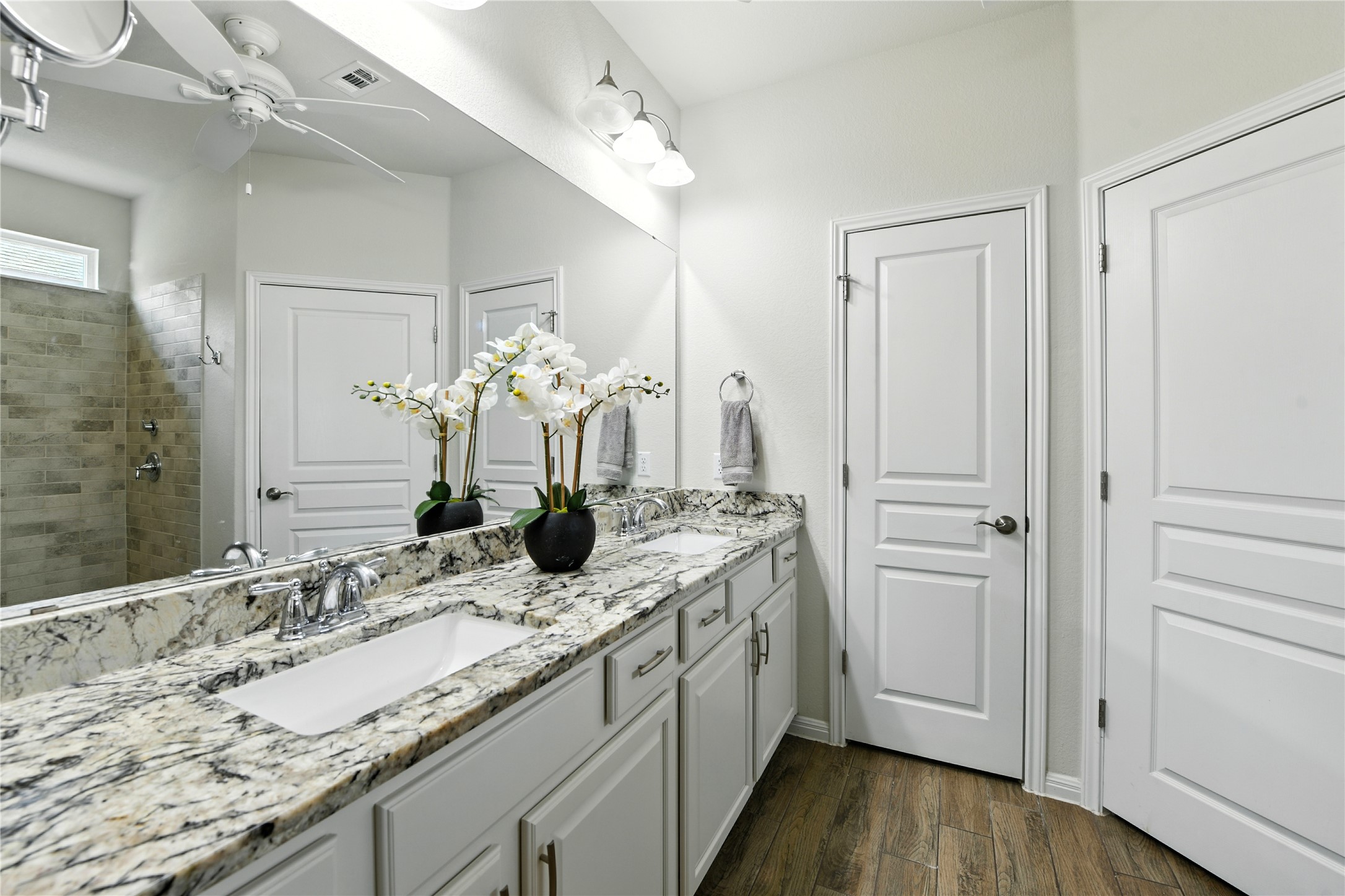 107 Calhoun Lane Georgetown, TX 78633 - Photo 21 of 36 Dual vanities and a large walk in closet