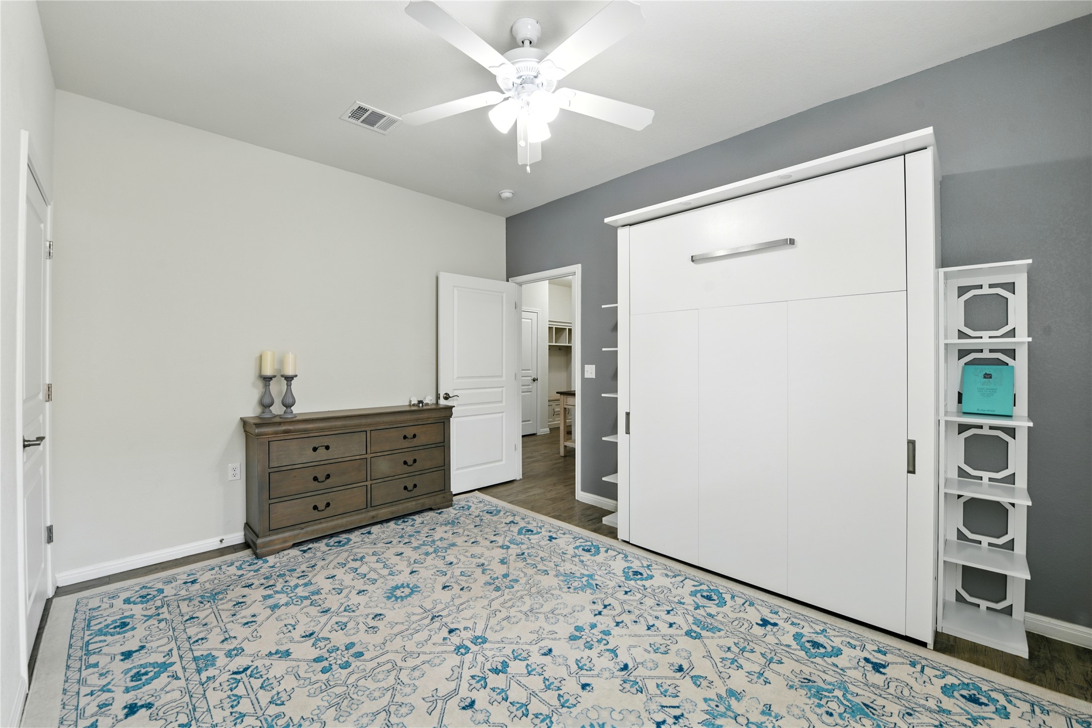 107 Calhoun Lane Georgetown, TX 78633 - Photo 24 of 36 Bedroom with a closet, ceiling fan, and wood look tile floors