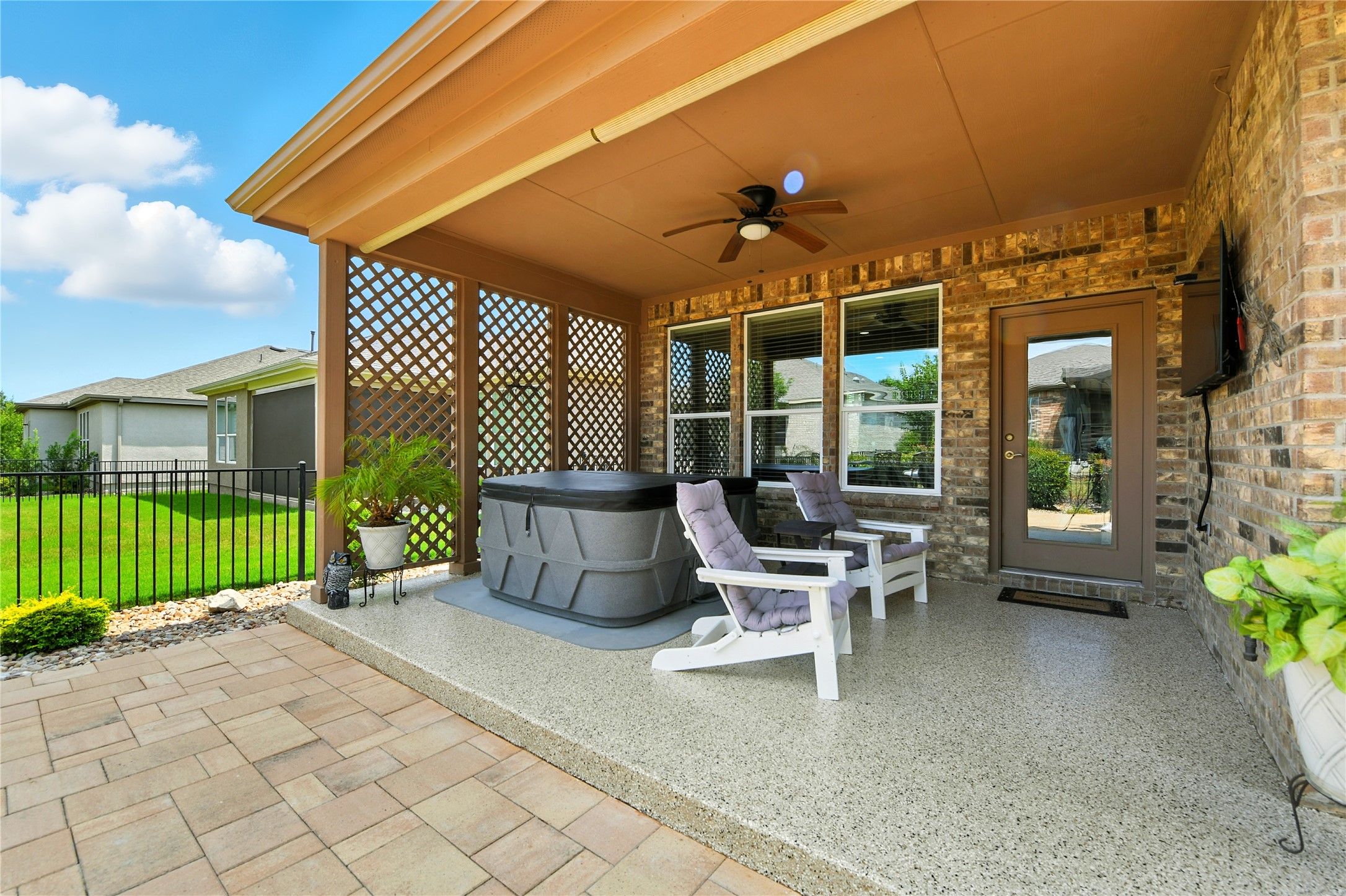 107 Calhoun Lane Georgetown, TX 78633 - Photo 30 of 36 Enjoy the covered patio with hot tub and TV