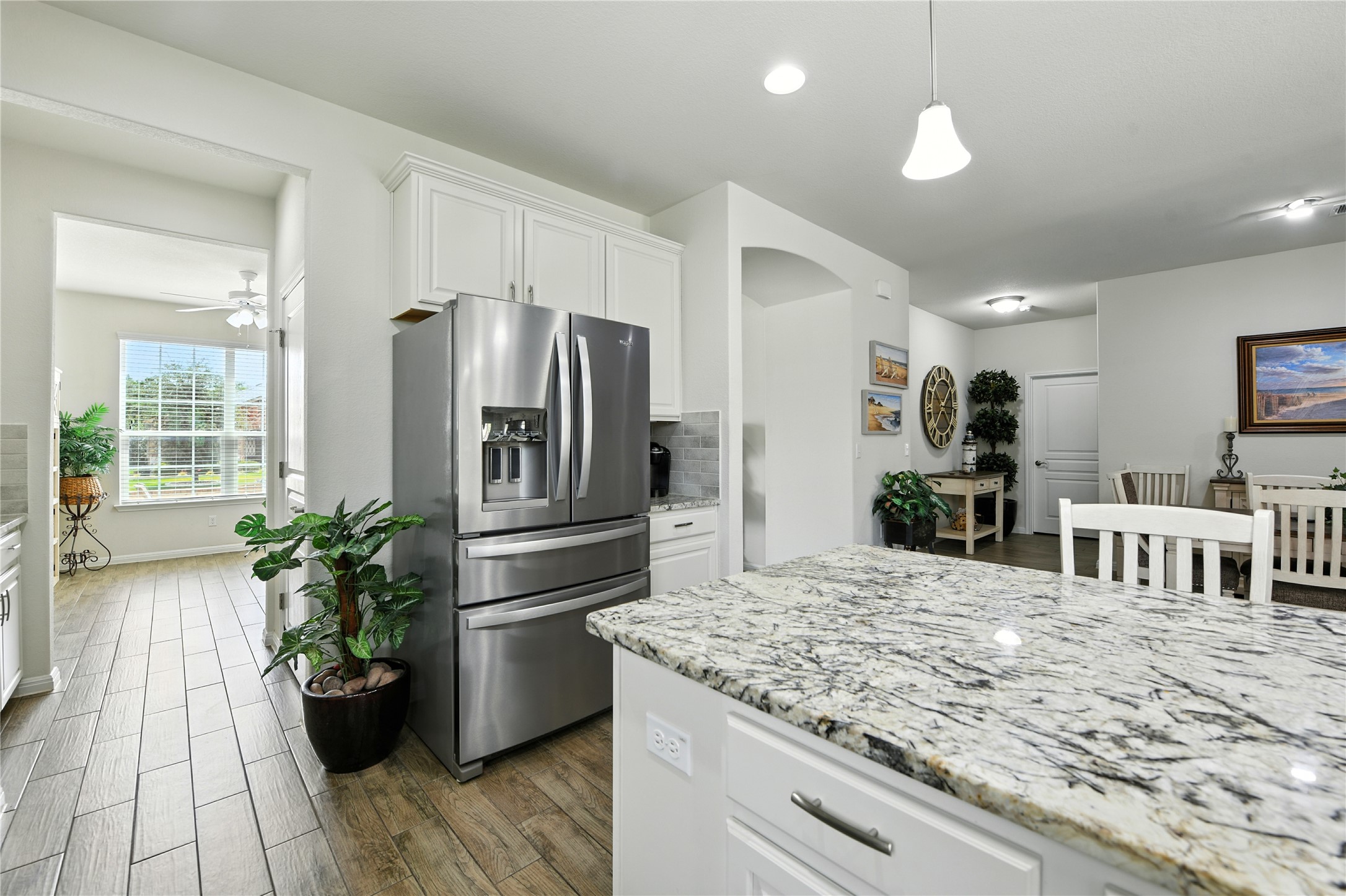 107 Calhoun Lane Georgetown, TX 78633 - Photo 5 of 36 Kitchen with light countertops, white cabinets, stainless steel appliances