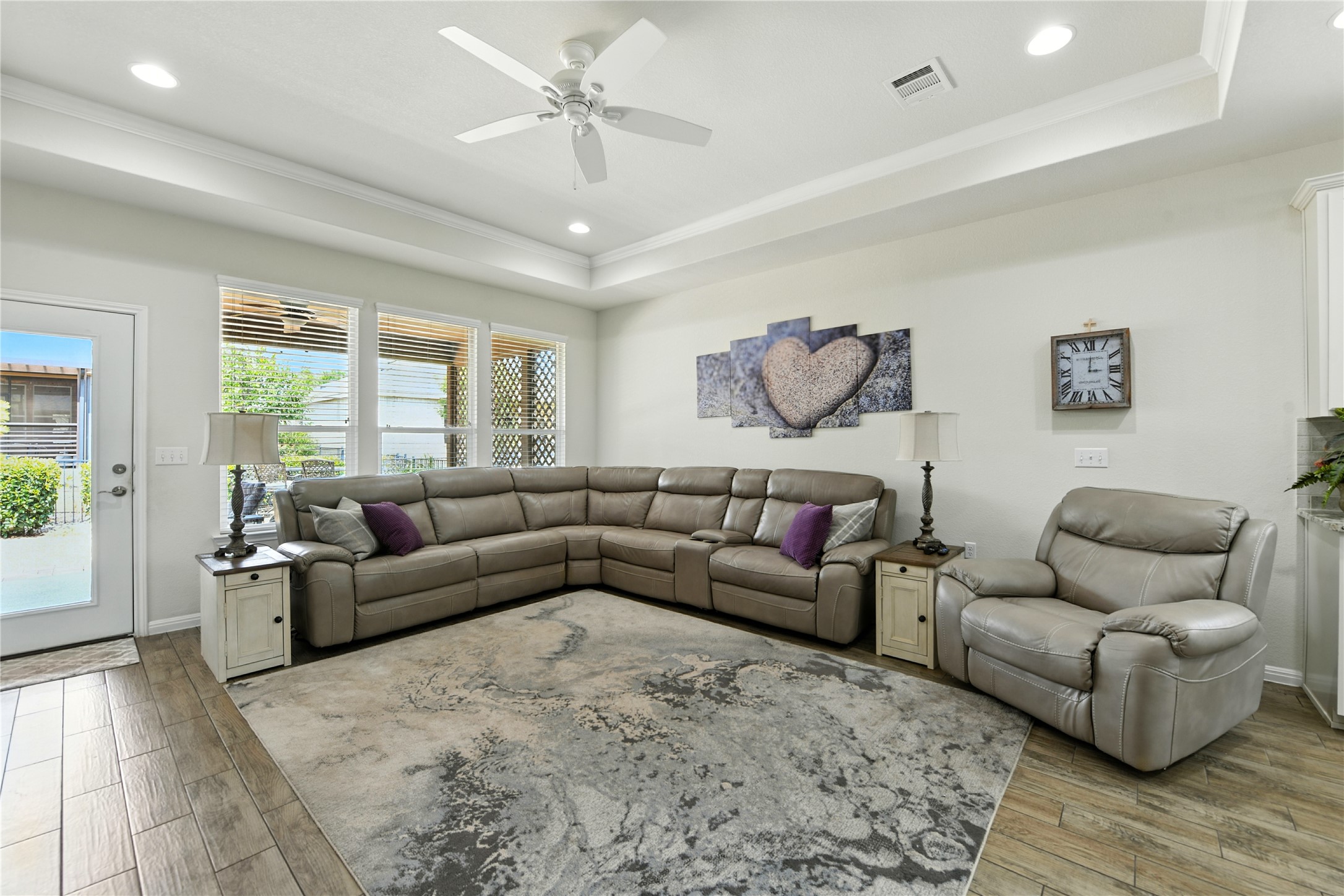 107 Calhoun Lane Georgetown, TX 78633 - Photo 9 of 36 Living room boasts a tray ceiling
