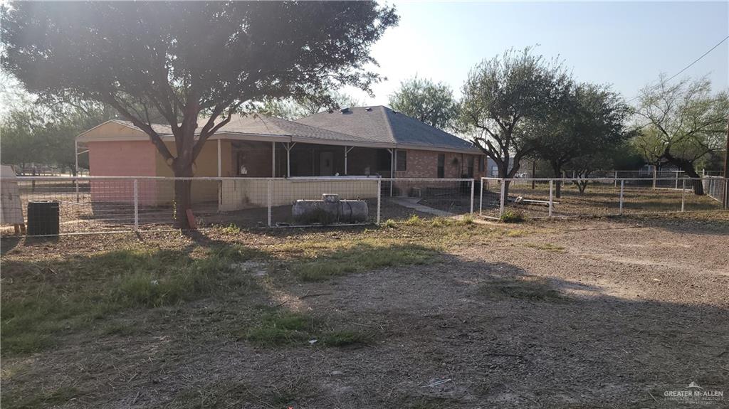 1808 North Mayberry Road Alton, TX 78573 - Photo 2 of 12 a view of a yard with wooden fence