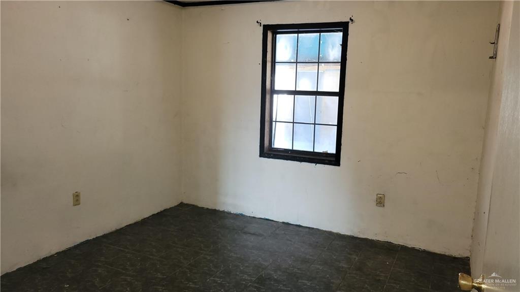1808 North Mayberry Road Alton, TX 78573 - Photo 7 of 12 an empty room with a window