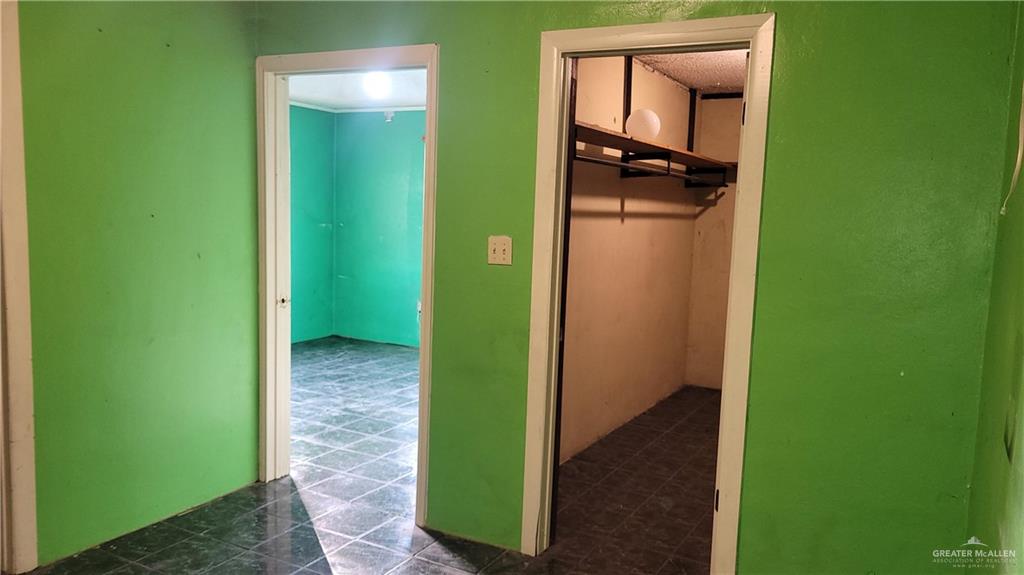 1808 North Mayberry Road Alton, TX 78573 - Photo 9 of 12 a view of a hallway with a storage & utility room