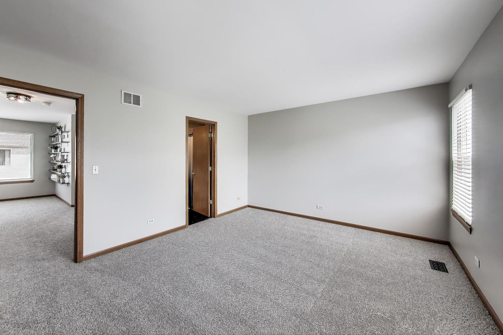 985 Manchester Circle, Unit 985 Grayslake, IL 60030 - Photo 12 of 17 an empty room with windows