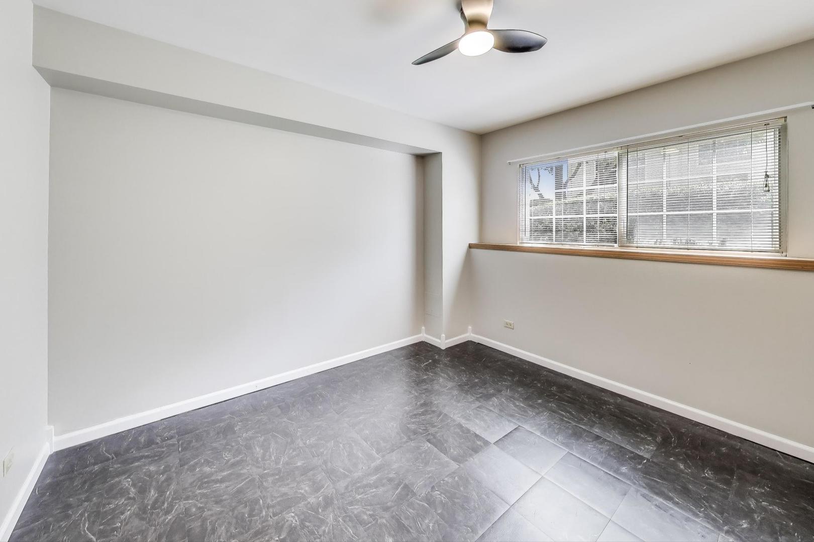 985 Manchester Circle, Unit 985 Grayslake, IL 60030 - Photo 15 of 17 an empty room with a empty space and windows