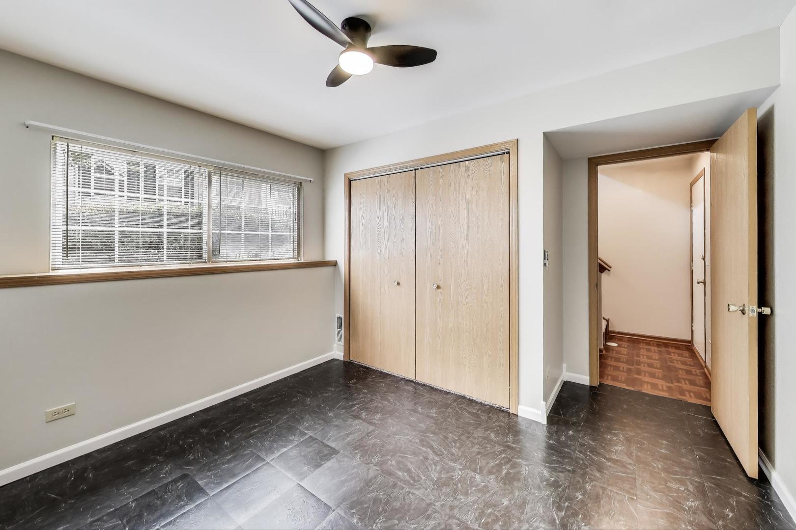 985 Manchester Circle, Unit 985 Grayslake, IL 60030 - Photo 16 of 17 an empty room with windows and closet