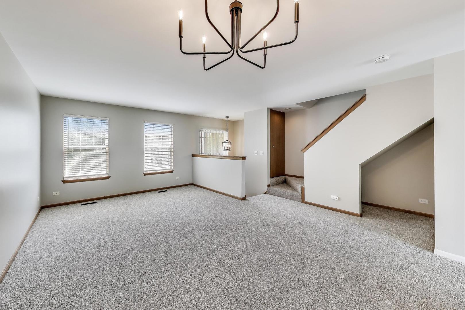 985 Manchester Circle, Unit 985 Grayslake, IL 60030 - Photo 4 of 17 a view of an empty room with a window