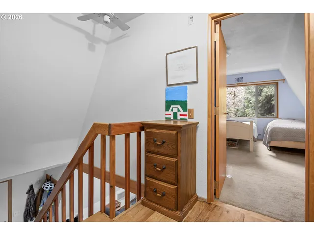 a view of a hallway and a livingroom with furniture