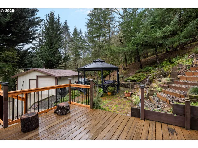 a view of a deck with furniture and wooden floor