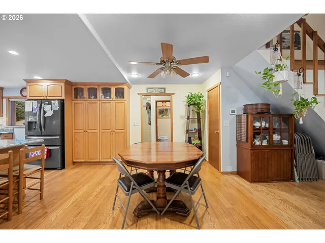 a dining room with furniture and window