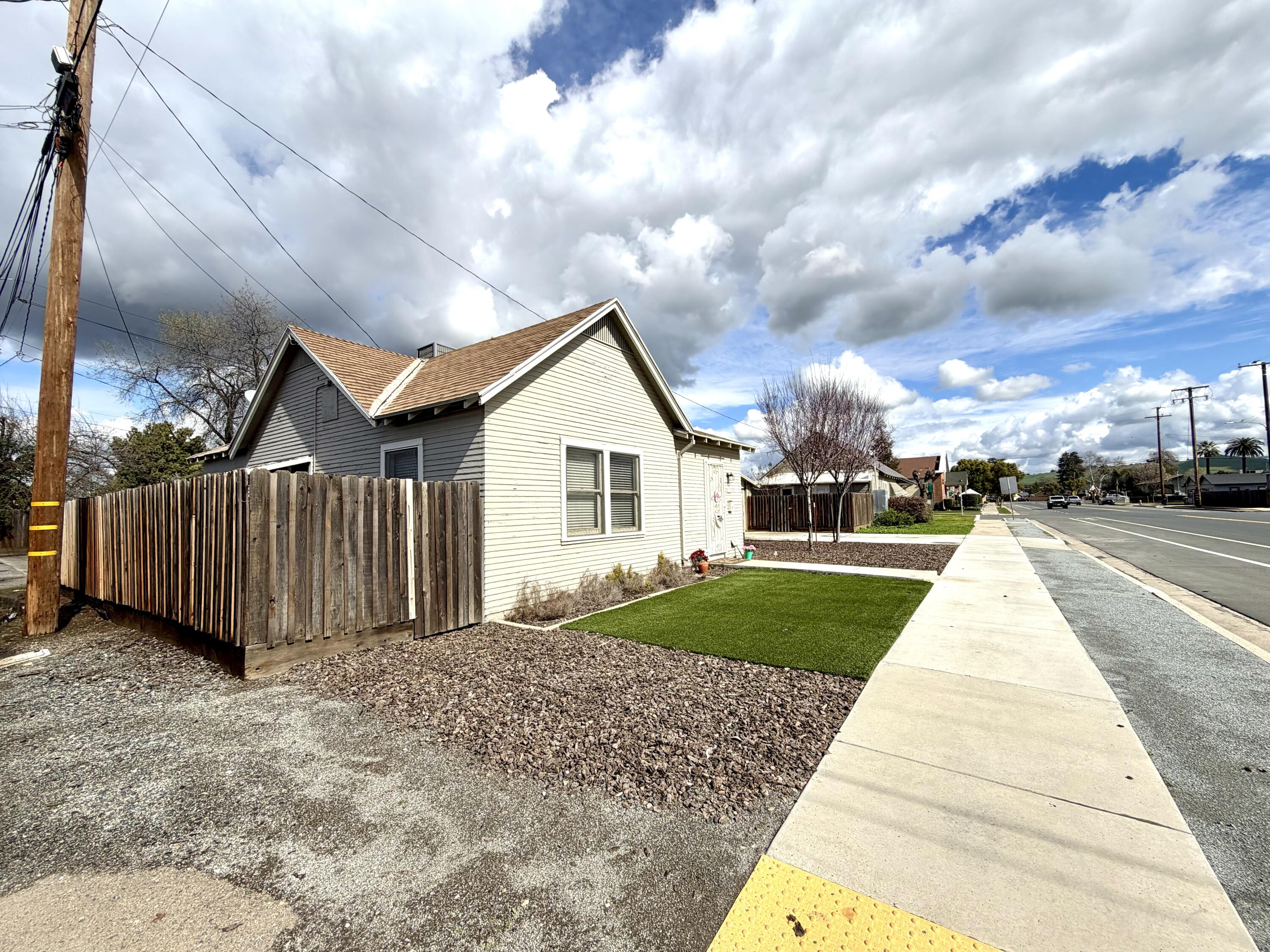 200 North B Street Exeter, CA 93221 - Photo 11 of 20 a view of a house with a yard