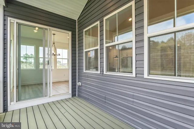 a view of a brick house with a large window