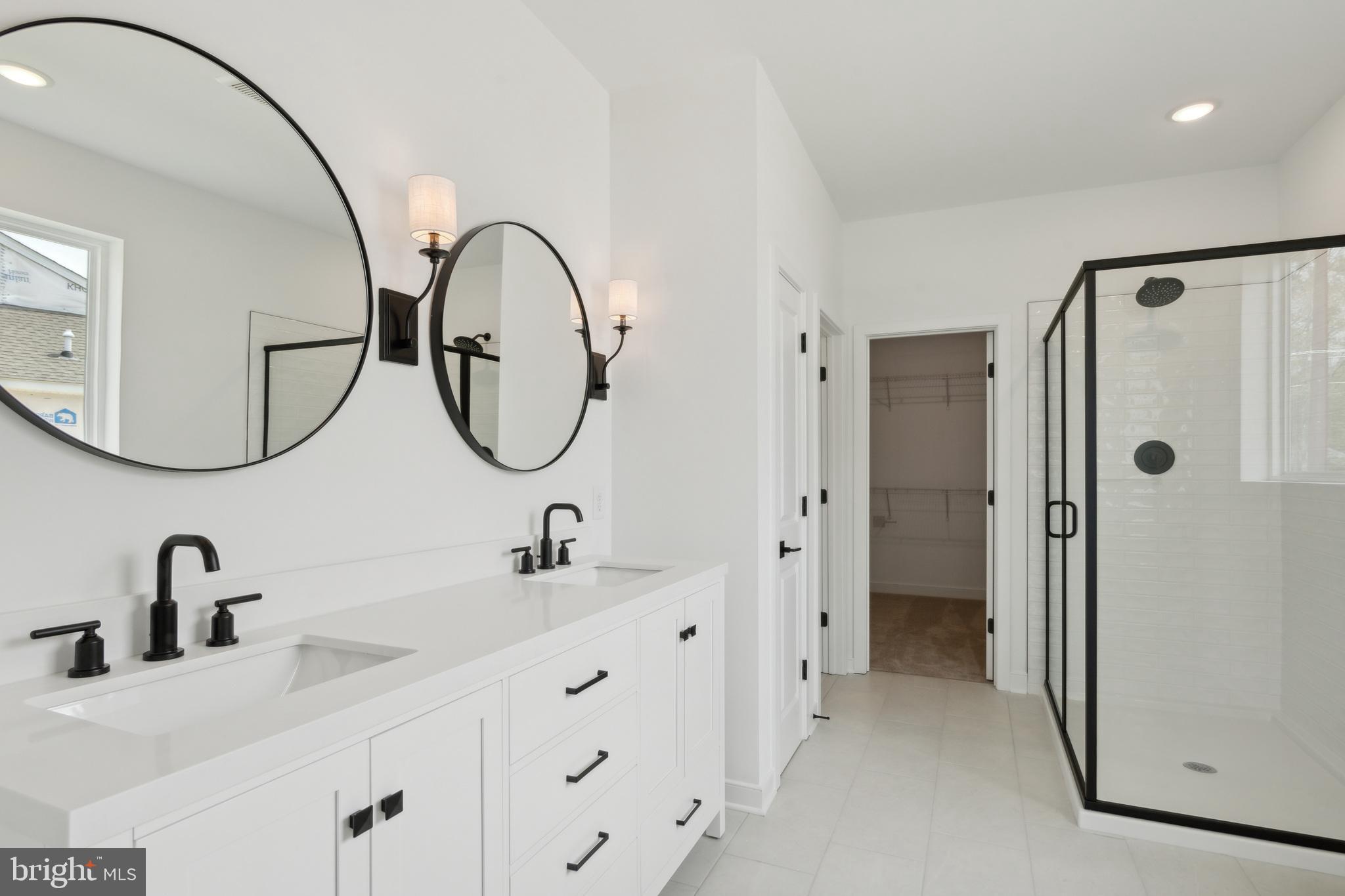 36449 Maple Ridge Lane Georgetown, DE 19947 - Photo 20 of 39 a bathroom with a double vanity sink and a mirror