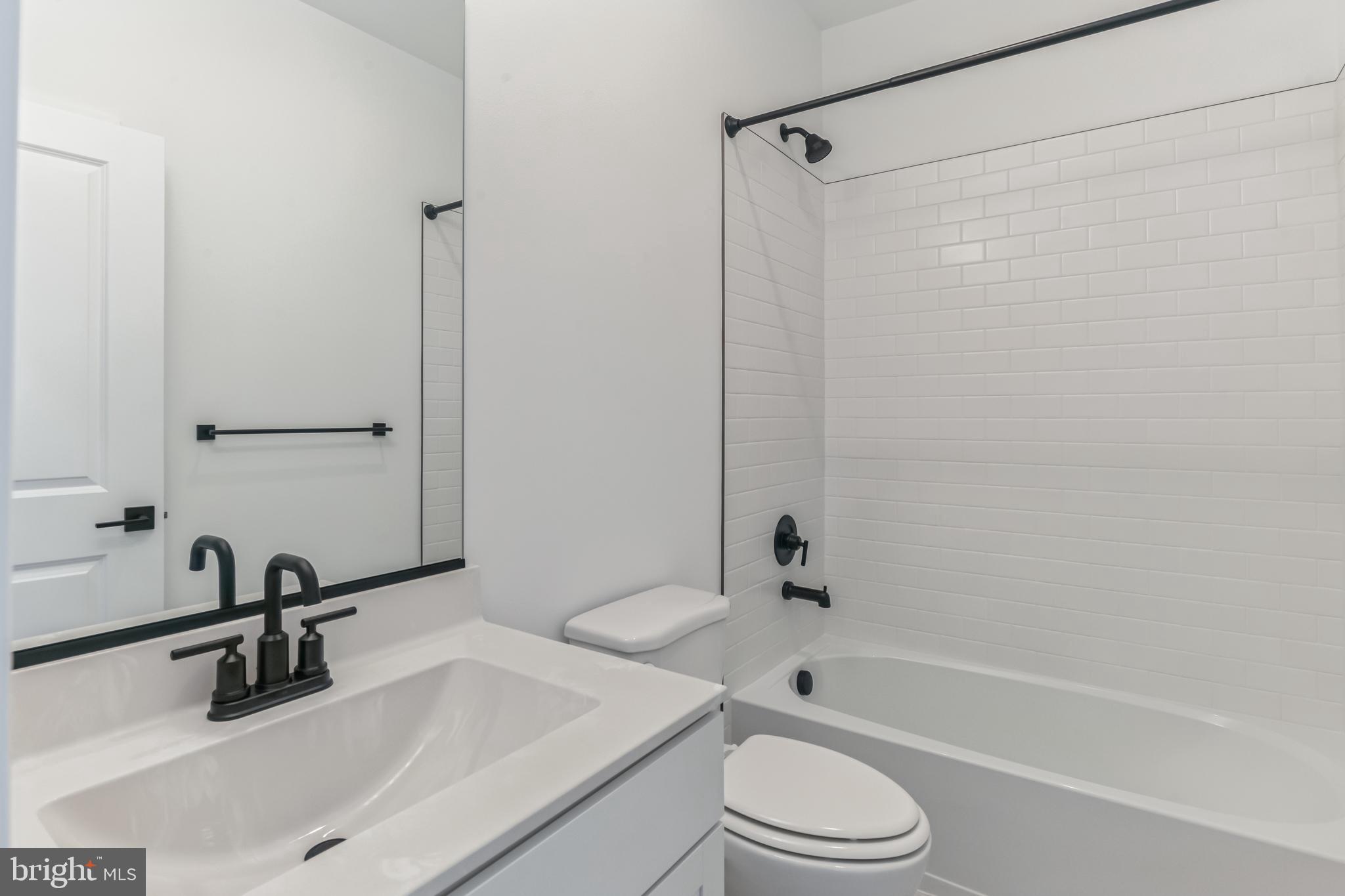 36449 Maple Ridge Lane Georgetown, DE 19947 - Photo 25 of 39 a bathroom with a sink toilet and shower