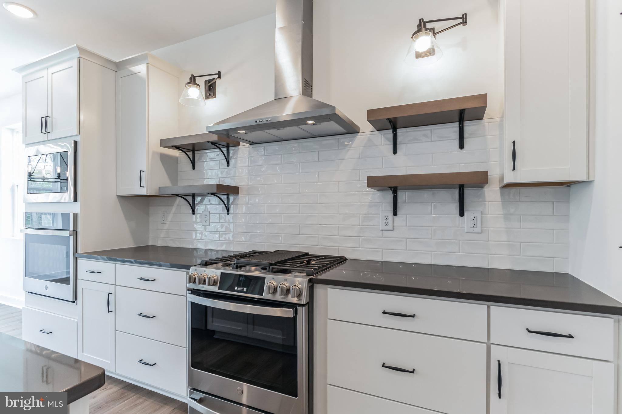 36449 Maple Ridge Lane Georgetown, DE 19947 - Photo 4 of 39 a kitchen with cabinets and stainless steel appliances