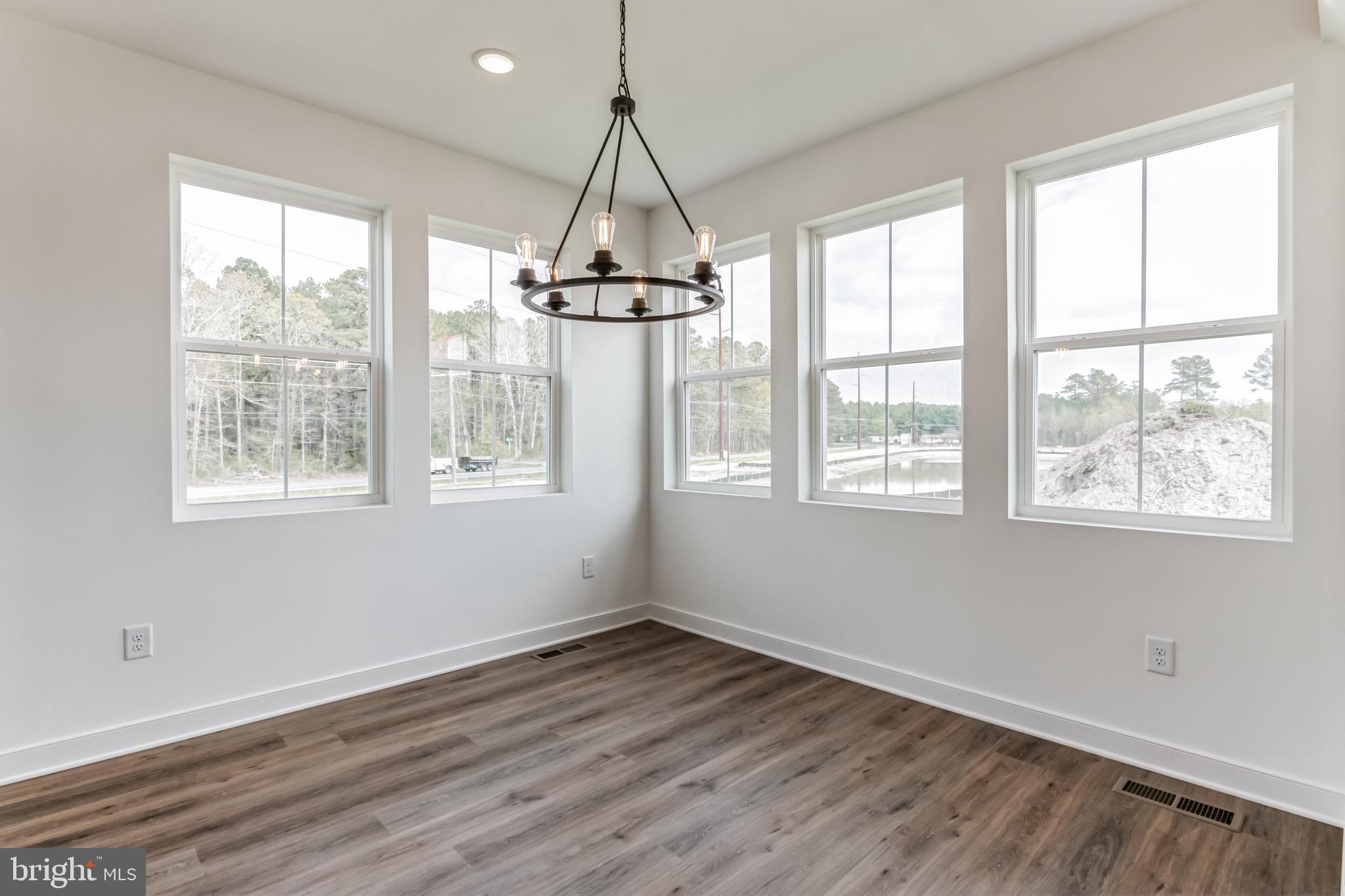 36449 Maple Ridge Lane Georgetown, DE 19947 - Photo 10 of 39 a room with window and wooden floor